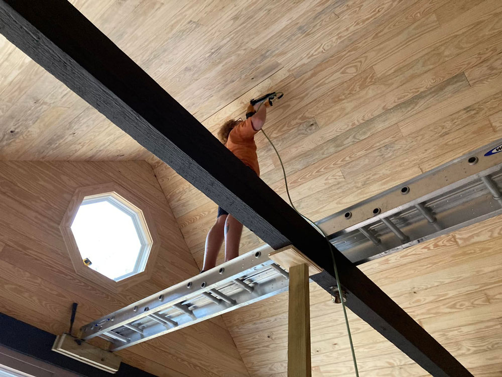 Santee Home improvement worker installing a wood panel ceiling